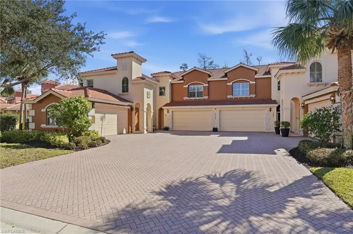 Mediterranean / spanish-style house featuring driveway, stucco siding, a garage, and a tiled roof
