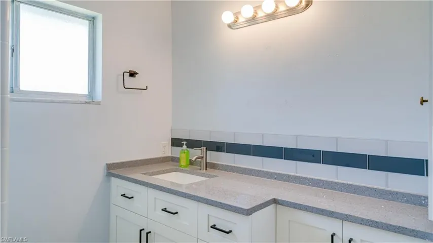 Bathroom with tile floors, toilet, and vanity