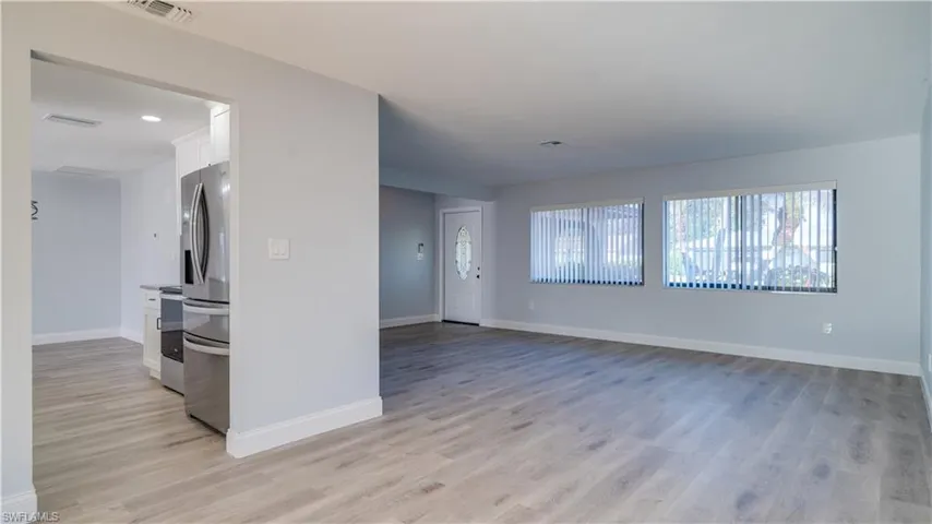 Spare room featuring ceiling fan and hardwood / wood-style flooring