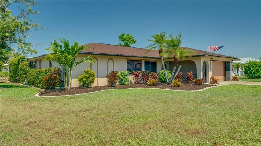 Freshly painted exterior with beautiful accent trim color for a pop. New roof installed in 2023. New screens in front porch. Screens to enclose garage to make working in the garage a breeze!