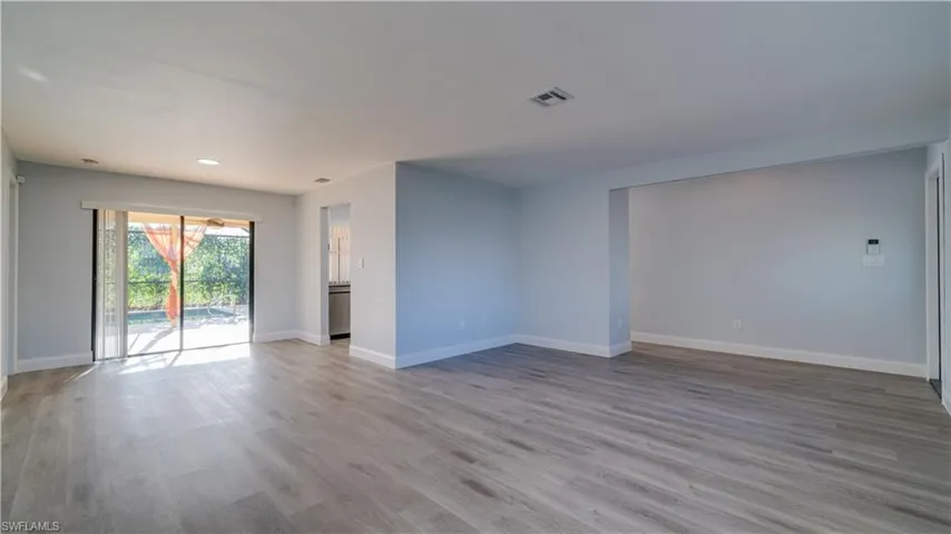Living and Dining Space with all new luxury plank vinyl throughout the home. Fresh coat of Behr premium paint on all the walls. New baseboards throughout the home. All new LED lighting with "Night Light" feature.
