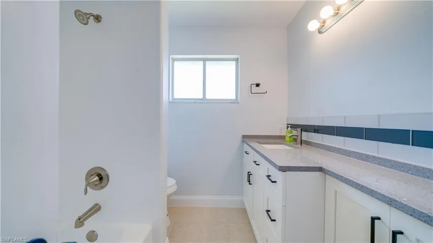 Unfurnished bedroom with a closet, ceiling fan, and light hardwood / wood-style flooring