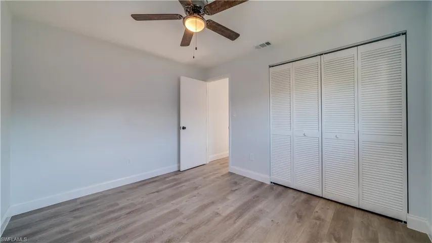 Spare room featuring hardwood / wood-style floors and ceiling fan