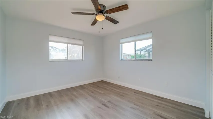 Unfurnished bedroom with a closet, ceiling fan, and light hardwood / wood-style flooring