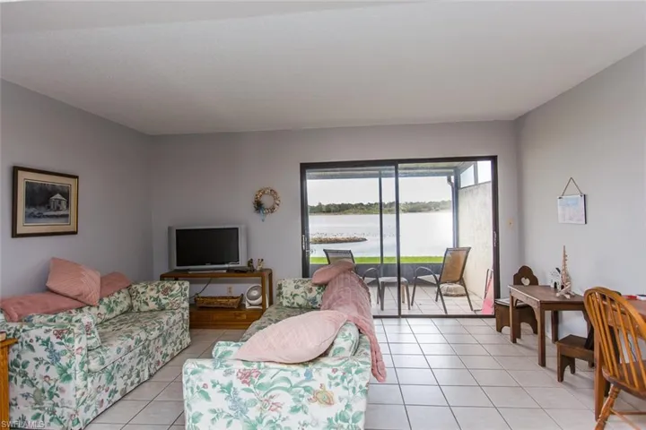 Living room with light tile patterned flooring