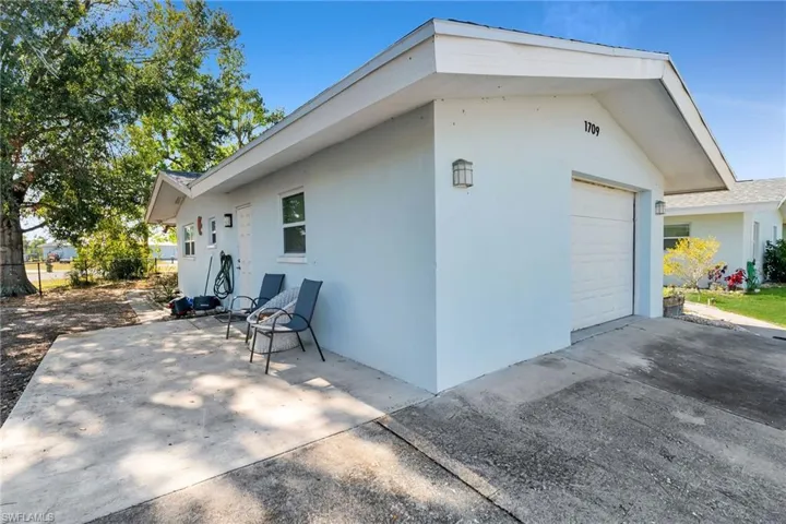 View of side of home with a garage