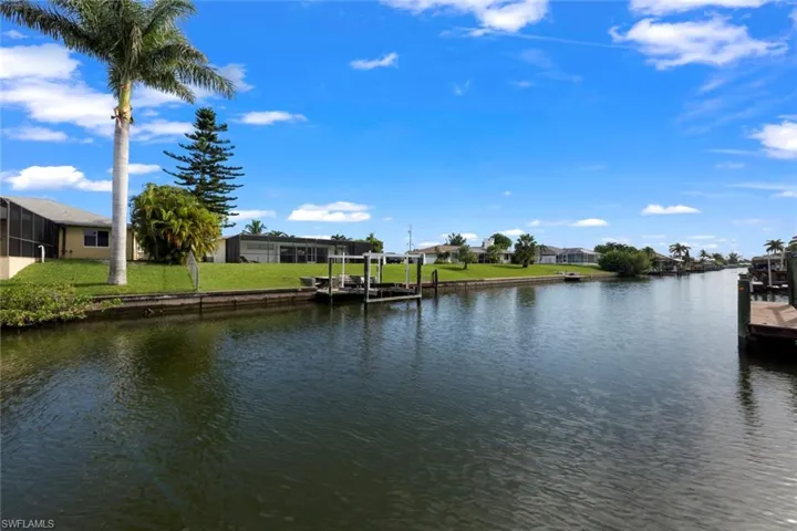 Property view of water featuring a dock