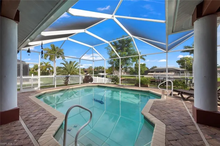 View of pool featuring a patio and a lanai