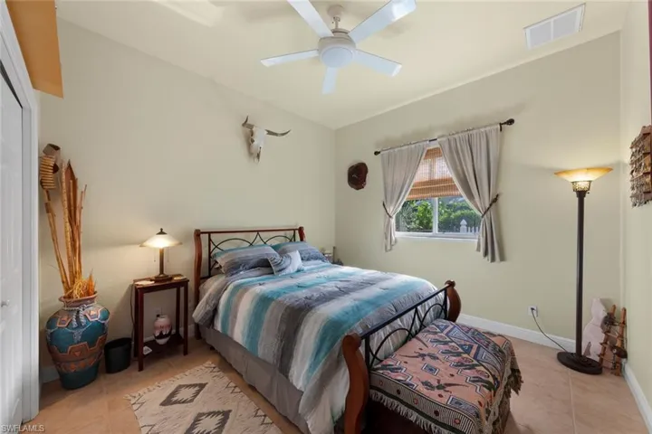 Bedroom featuring ceiling fan and light tile patterned floors