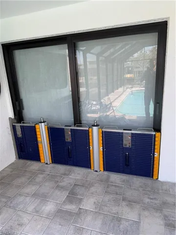 Three Panels and two extension poles protecting this two door slider