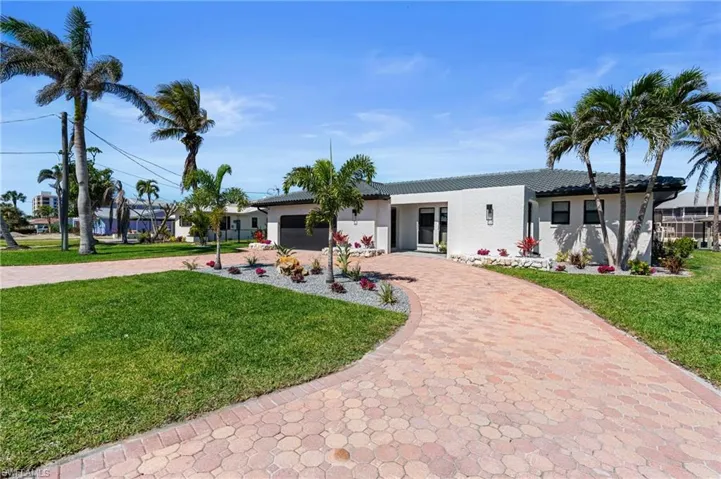 Tiled entryway, new windows and front door and refreshed landscaping  (Photo digitally enhanced)