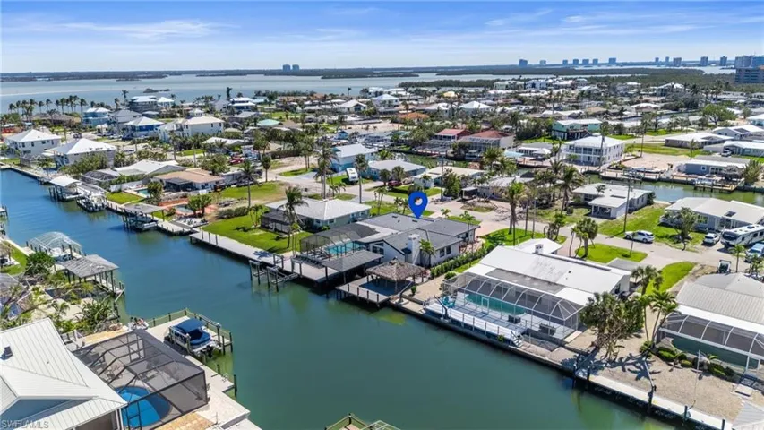 Boating and entertaining dream house.  Pool/Spa, Tiki hut and a boat house for your visitors   (Photo digitally enhanced)