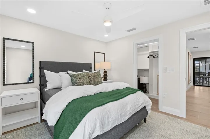 Airy and spacious Bedroom #4 featuring designer closet.   (Photo digitally enhanced)