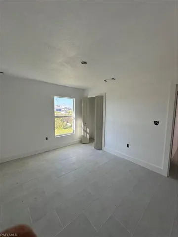 Unfurnished bedroom with a textured ceiling and a closet