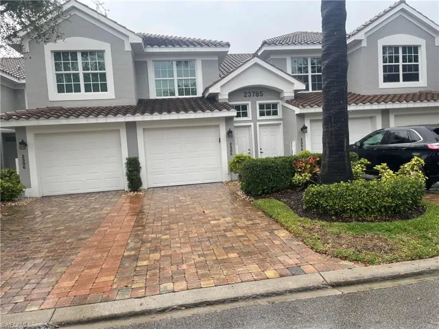 View of front of property with a garage