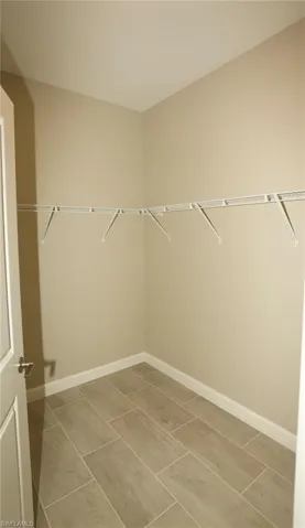 Neutral-toned walls and wood-look tile flooring