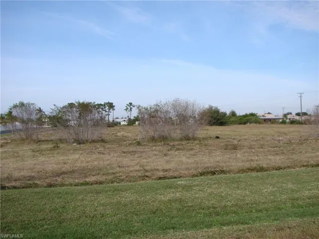 View of yard with a rural view