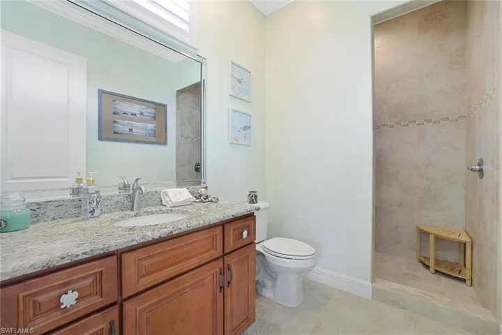 3rd Guest Bathroom with tile floors, crown molding, toilet, and vanity