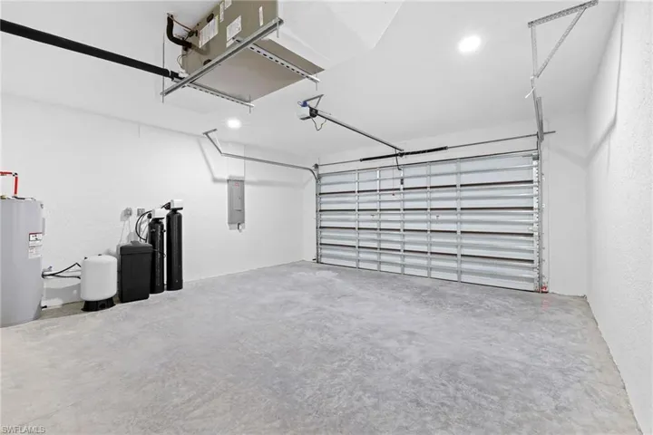 Garage with electric water heater and electric panel