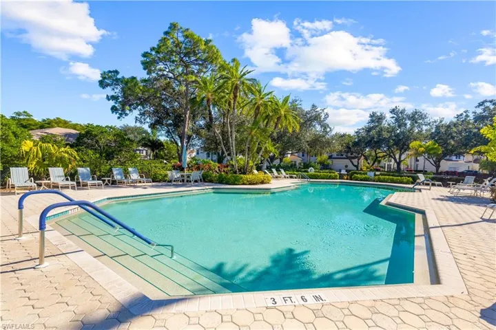Community pool featuring a patio