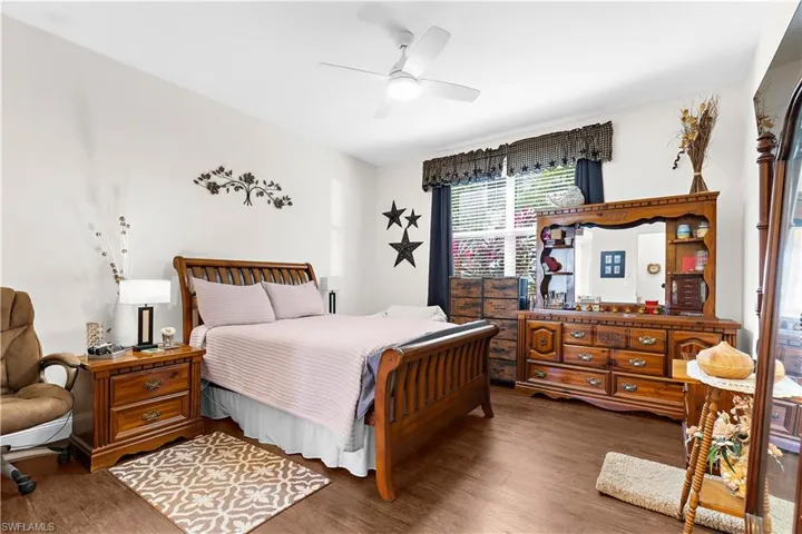 Bedroom with wood finished floors and a ceiling fan