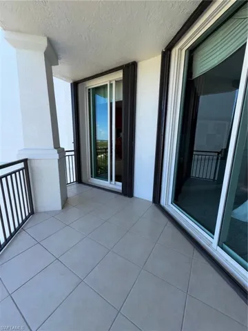 View of front balcony with accordion hurr. shutters