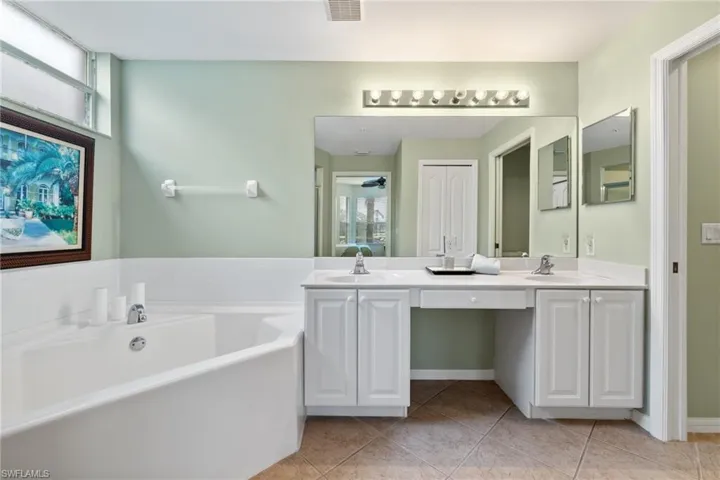 Owners bathroom with separate tub and shower