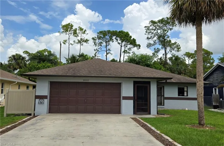 Ranch-style home with a front yard