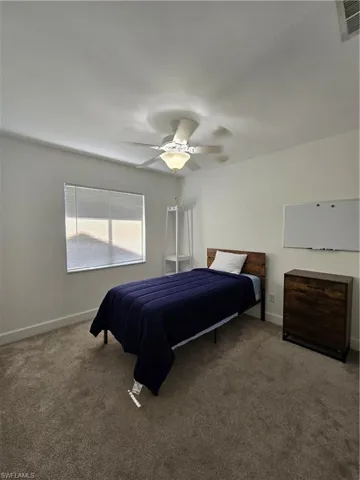 Bedroom featuring carpet floors and ceiling fan