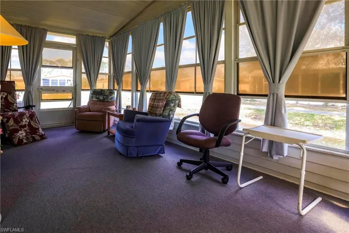 Sunroom with lofted ceiling
