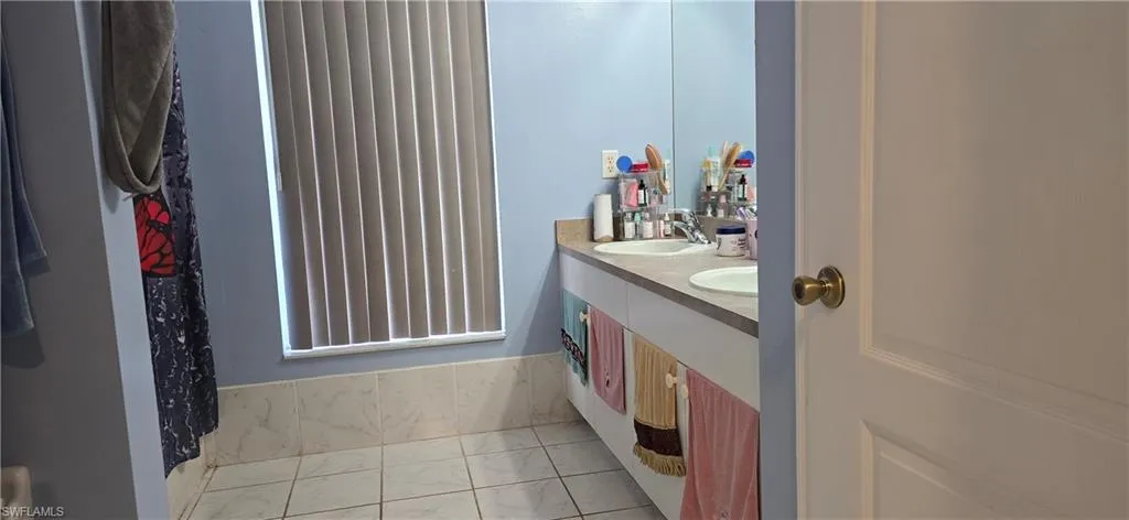 Bathroom featuring double vanity