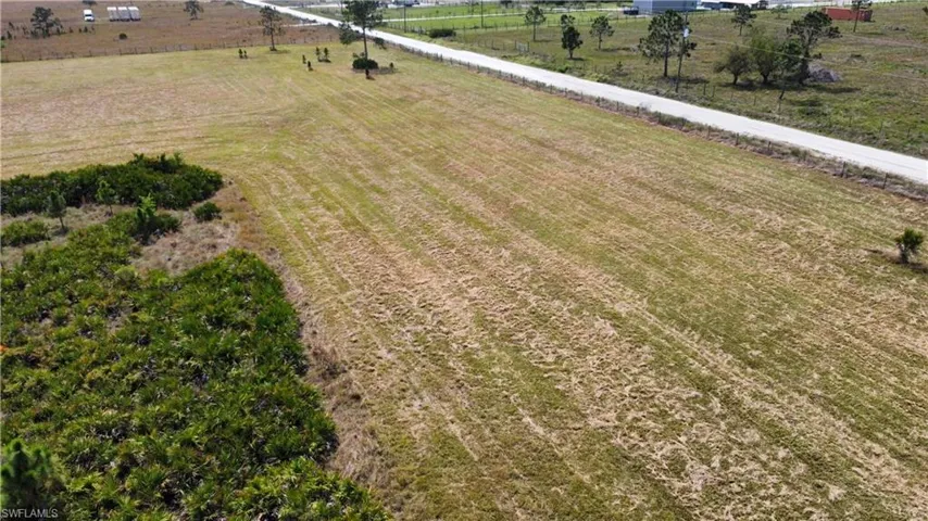 Birds eye view of property featuring a rural view