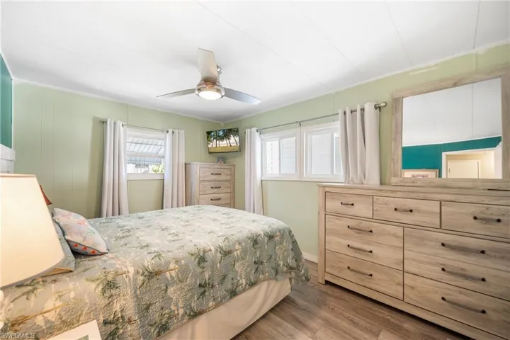 Bedroom with light wood-type flooring and a ceiling fan