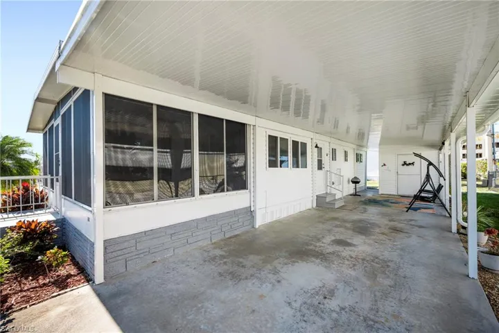 View of patio / terrace with an attached carport