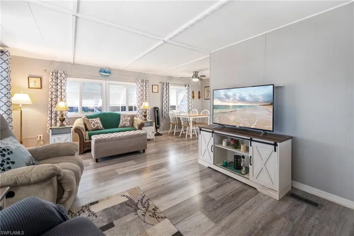 Living room with wood finished floors and baseboards