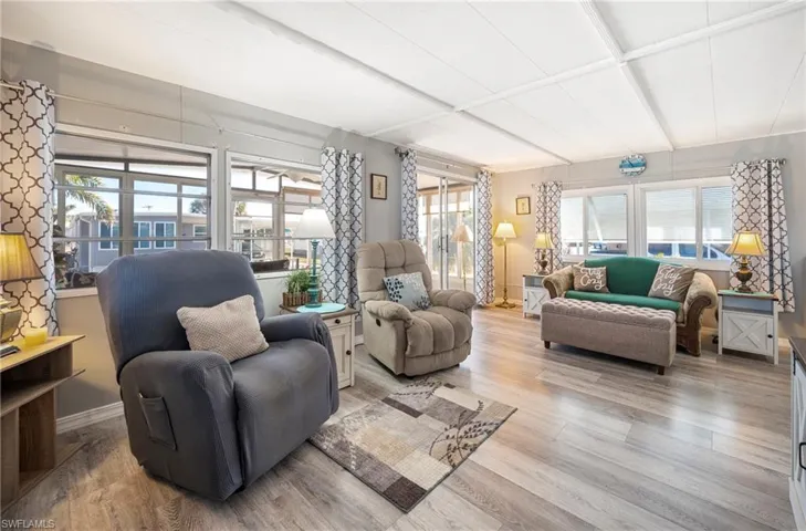 Living area featuring light wood finished floors and plenty of natural light