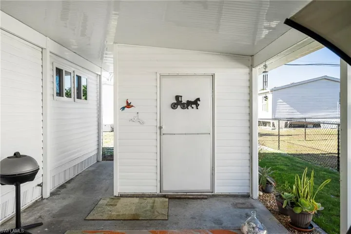 Property entrance with a patio area