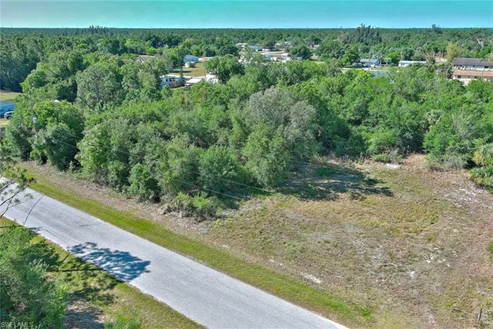 Aerial overview of property's location with a forest