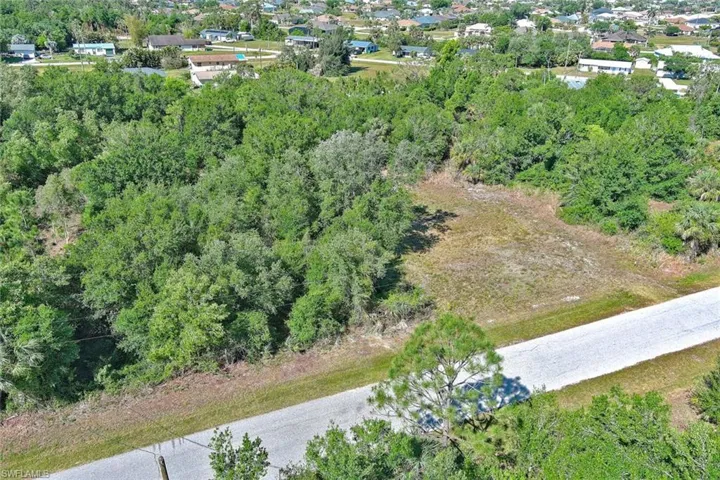 View of property location with a forest