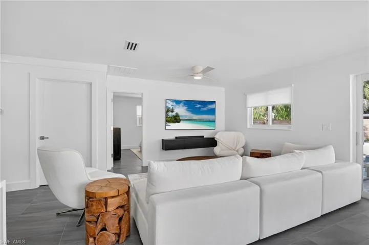 Living area featuring ceiling fan