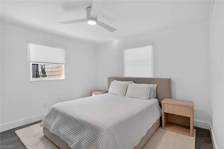 Bedroom with ceiling fan and wood finished floors