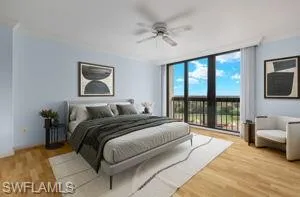 Bedroom with floor to ceiling windows, access to outside, light hardwood / wood-style flooring, and ceiling fan