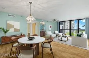 Dining room featuring ceiling fan and hardwood / wood-style floors