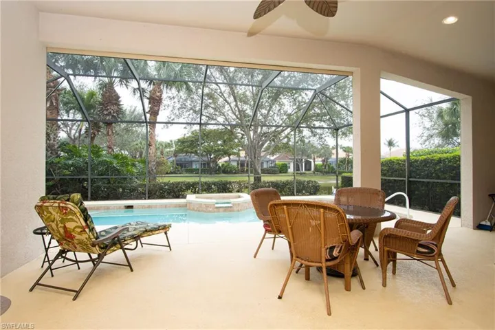 Sunroom featuring a pool