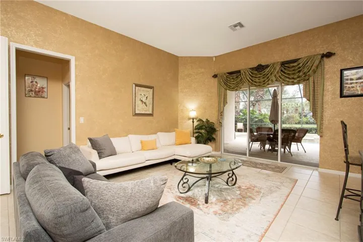 Living room with light tile patterned floors