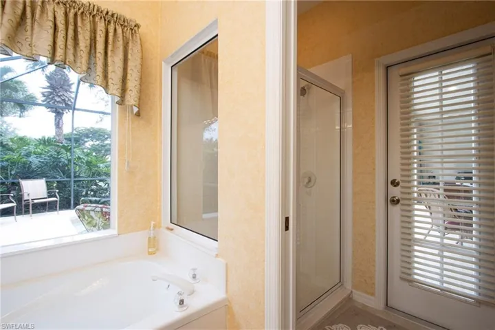Bathroom with shower with separate bathtub