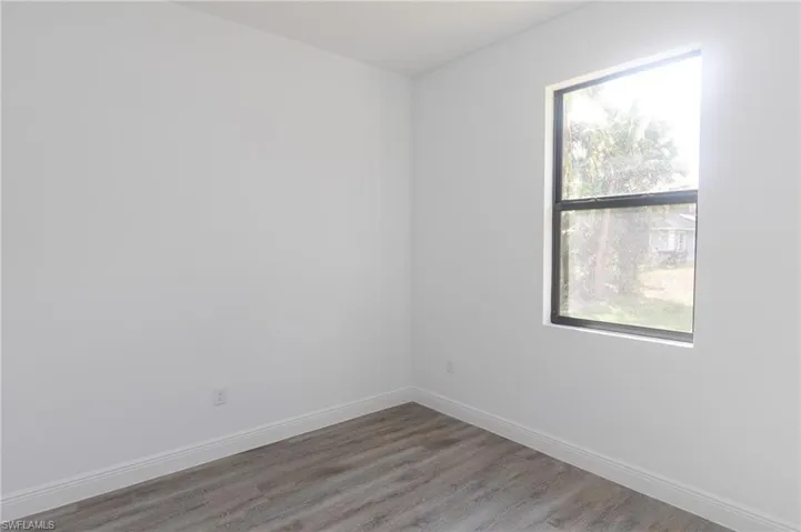 Bedroom with vinyl floors.