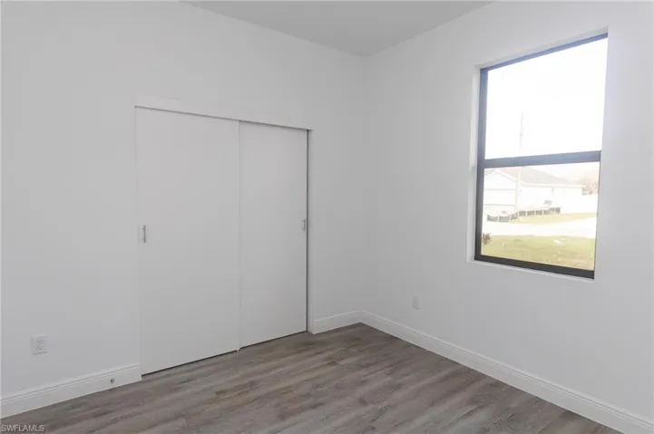 Bedroom with vinyl floors.