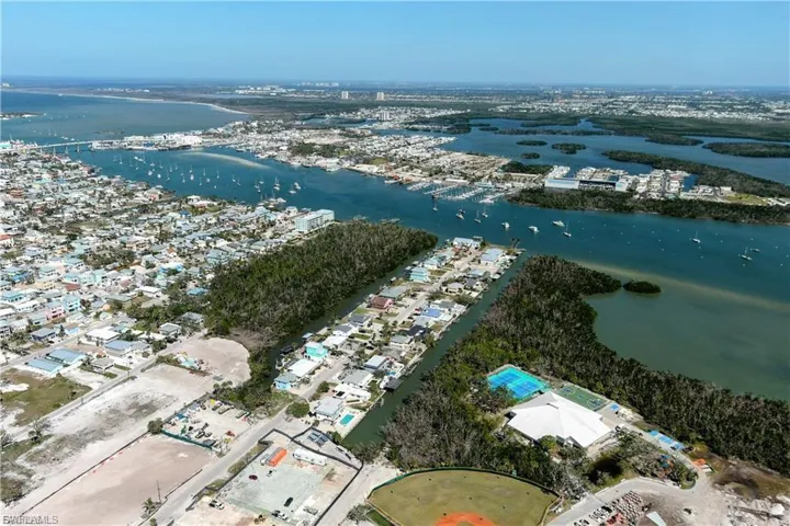 Aerial view of property's location featuring a large body of water