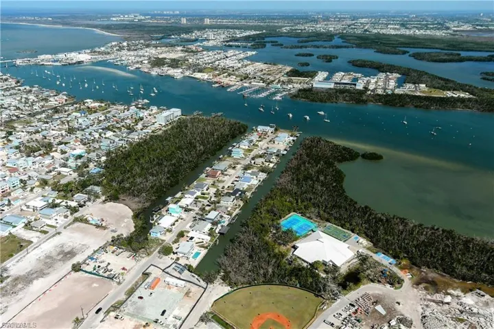 Aerial view of property and surrounding area featuring a large body of water